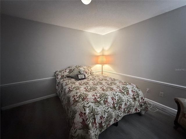51 Fore Dr, New Smyrna Beach, FL 32168 - bedroom with wood finished floors and a textured ceiling
