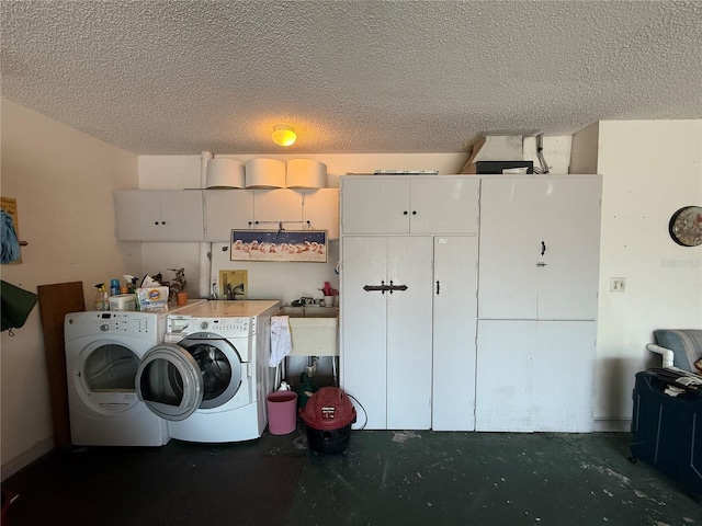 51 Fore Dr, New Smyrna Beach, FL 32168 - washroom featuring washing machine and dryer, cabinet space, and a textured ceiling
