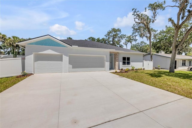 2324 Orange Tree Dr, Edgewater, FL 32141 - view of front facade with an attached garage, driveway, and stucco siding