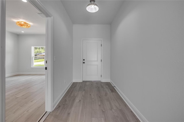 2324 Orange Tree Dr, Edgewater, FL 32141 - hall with light wood-style flooring and baseboards