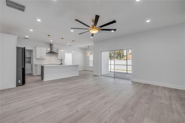 2324 Orange Tree Dr, Edgewater, FL 32141 - unfurnished living room featuring recessed lighting, ceiling fan, and light wood finished floors