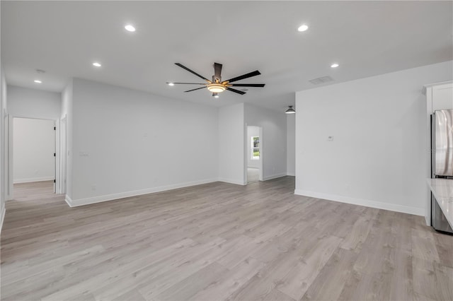 2324 Orange Tree Dr, Edgewater, FL 32141 - unfurnished living room with a ceiling fan, recessed lighting, and light wood-style flooring