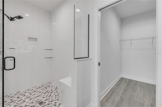 2324 Orange Tree Dr, Edgewater, FL 32141 - full bath featuring a stall shower, wood finished floors, and a walk in closet