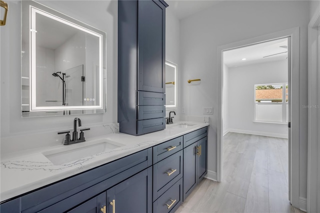 2324 Orange Tree Dr, Edgewater, FL 32141 - bathroom with double vanity, wood finished floors, and a shower