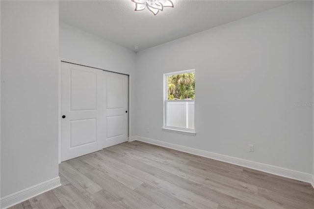 2324 Orange Tree Dr, Edgewater, FL 32141 - unfurnished bedroom featuring light wood-type flooring and a closet