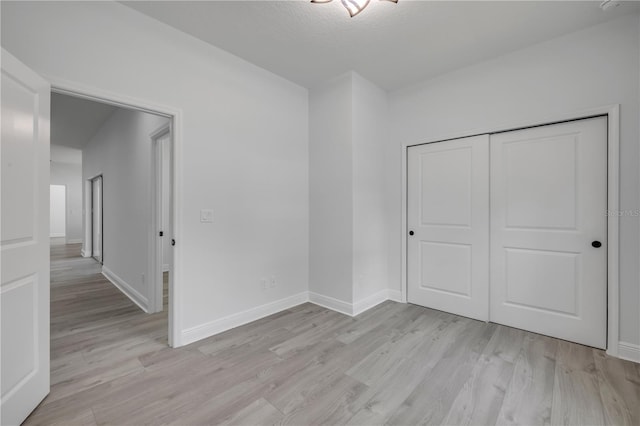 2324 Orange Tree Dr, Edgewater, FL 32141 - unfurnished bedroom with light wood finished floors and a closet