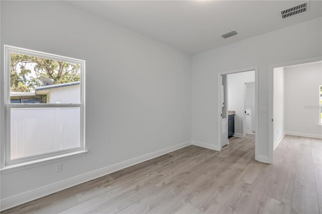 2324 Orange Tree Dr, Edgewater, FL 32141 - unfurnished room with light wood-style floors and baseboards