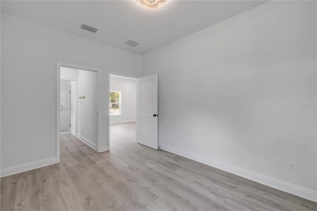 2324 Orange Tree Dr, Edgewater, FL 32141 - empty room with light wood-style floors and baseboards