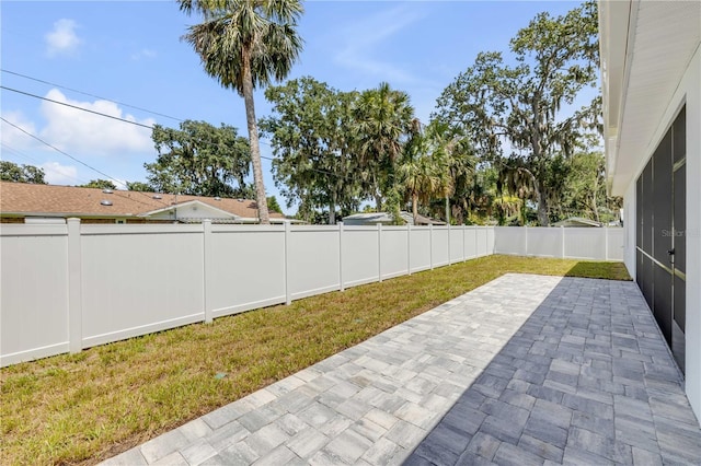 2324 Orange Tree Dr, Edgewater, FL 32141 - fenced backyard featuring a patio