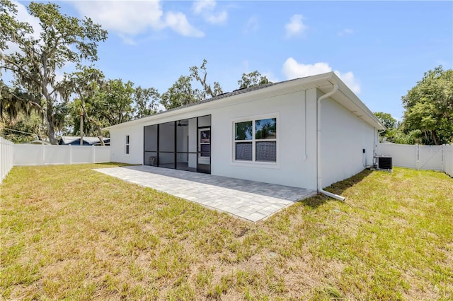 2324 Orange Tree Dr, Edgewater, FL 32141 - rear view of property featuring a fenced backyard, a patio, stucco siding, and a sunroom