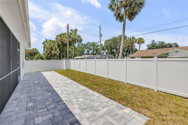 2324 Orange Tree Dr, Edgewater, FL 32141 - fenced backyard featuring a patio