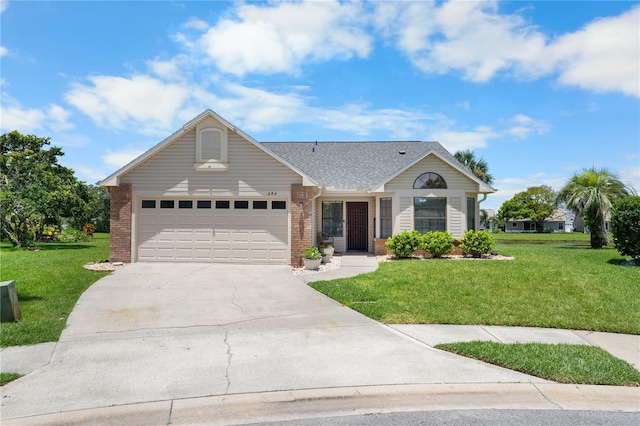 684 Rochester Ct, New Smyrna Beach, FL 32168 - view of front of property featuring brick siding, driveway, a garage, and a front yard