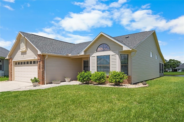 684 Rochester Ct, New Smyrna Beach, FL 32168 - ranch-style home with a shingled roof, a garage, concrete driveway, and a front yard