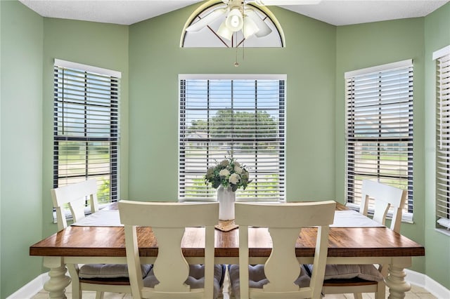 684 Rochester Ct, New Smyrna Beach, FL 32168 - dining area with ceiling fan and healthy amount of natural light