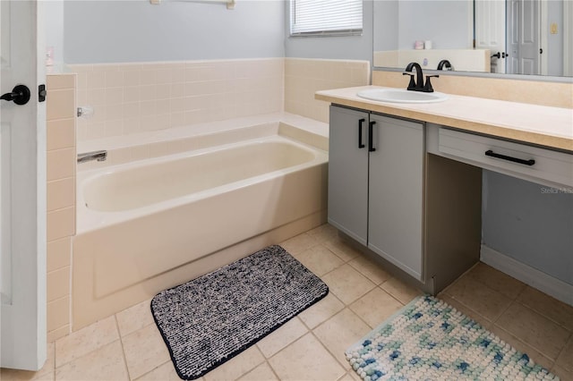 684 Rochester Ct, New Smyrna Beach, FL 32168 - full bathroom featuring vanity, a garden tub, and tile patterned flooring