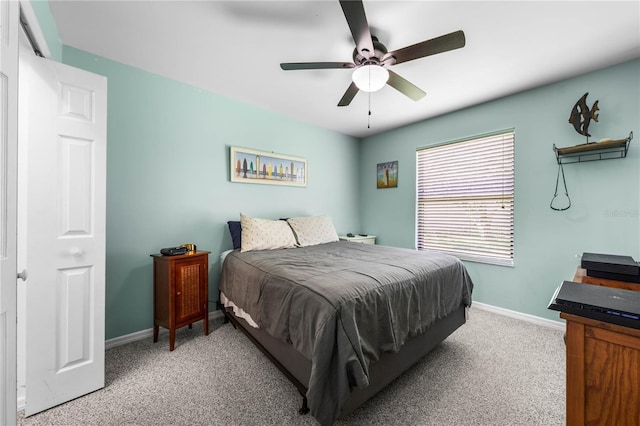 684 Rochester Ct, New Smyrna Beach, FL 32168 - bedroom with light colored carpet and ceiling fan