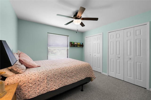 684 Rochester Ct, New Smyrna Beach, FL 32168 - carpeted bedroom featuring two closets and ceiling fan