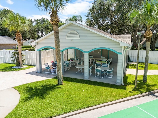 684 Rochester Ct, New Smyrna Beach, FL 32168 - view of community with a patio area and outdoor dining area