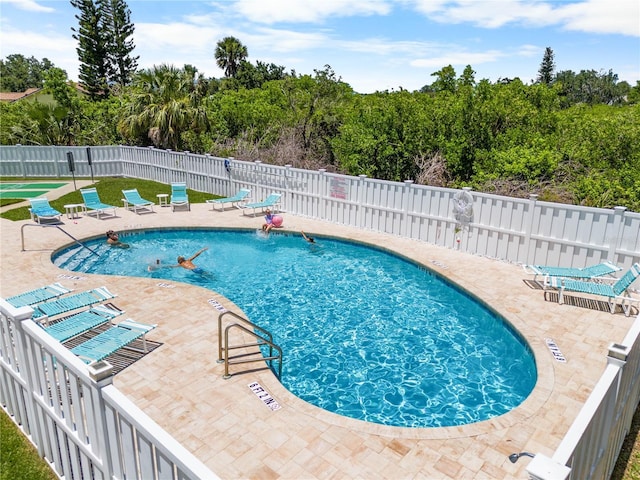 684 Rochester Ct, New Smyrna Beach, FL 32168 - community pool with a patio and view of scattered trees