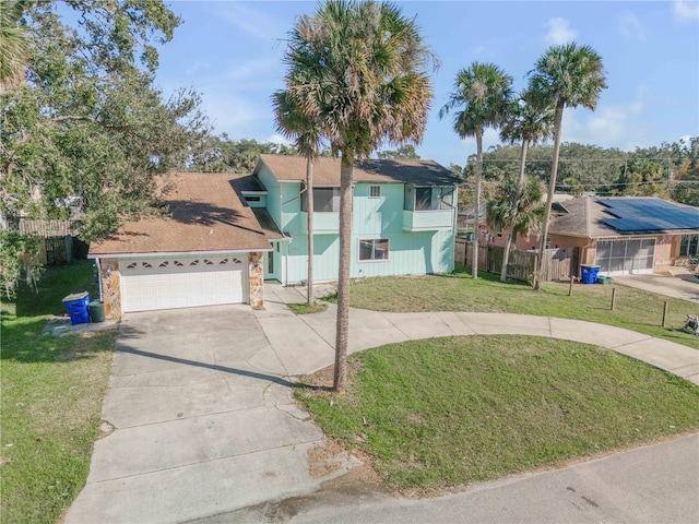2715 Pine Tree Dr, Edgewater, FL 32141 - view of front of house featuring driveway and stone siding