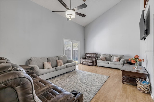 2715 Pine Tree Dr, Edgewater, FL 32141 - living room featuring high vaulted ceiling, ceiling fan, and light wood-style floors