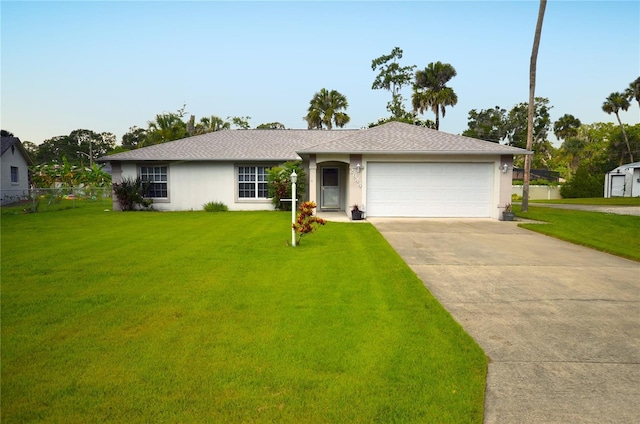2944 Mango Tree Dr, Edgewater, FL 32141 - single story home featuring stucco siding, a garage, driveway, and roof with shingles