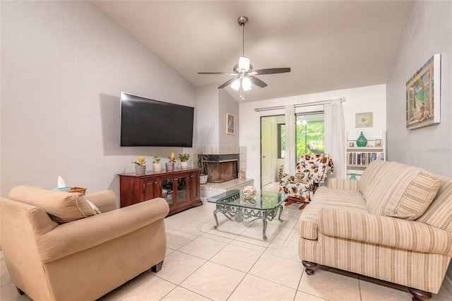 1237 Charter Oaks Cir, Daytona Beach, FL 32117 - living room with vaulted ceiling, ceiling fan, light tile patterned flooring, and a tile fireplace