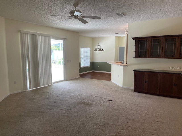 405 Central Mariners Dr, Edgewater, FL 32141 - unfurnished living room with carpet, ceiling fan, and a textured ceiling