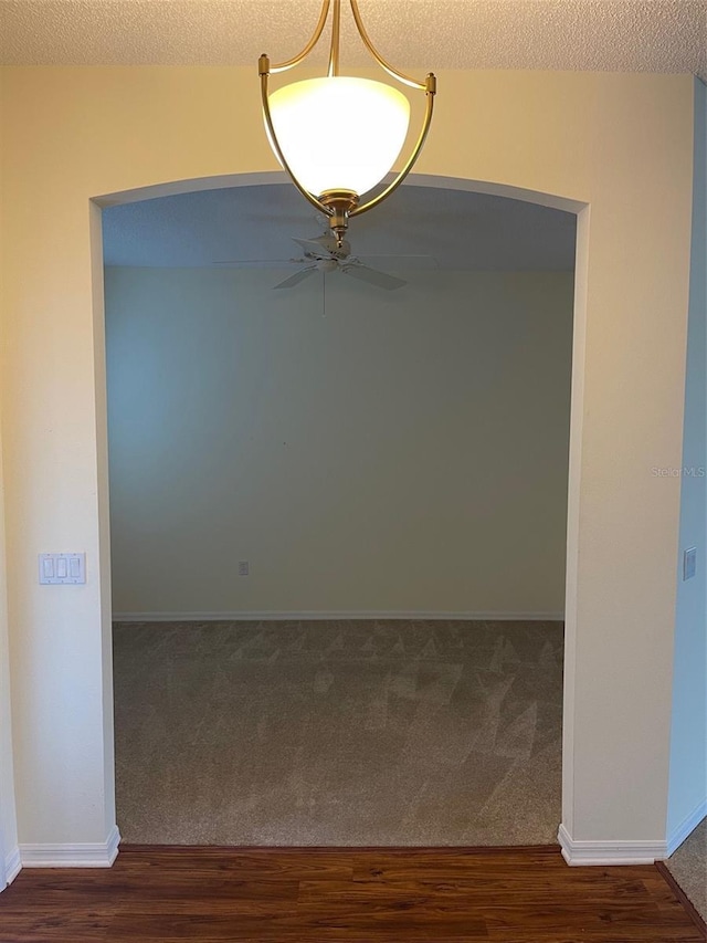 405 Central Mariners Dr, Edgewater, FL 32141 - spare room with carpet, ceiling fan, a textured ceiling, and wood finished floors