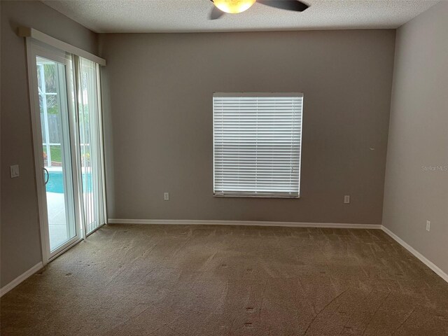 405 Central Mariners Dr, Edgewater, FL 32141 - carpeted spare room featuring a ceiling fan and a textured ceiling