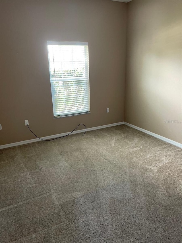 405 Central Mariners Dr, Edgewater, FL 32141 - spare room featuring baseboards and carpet floors