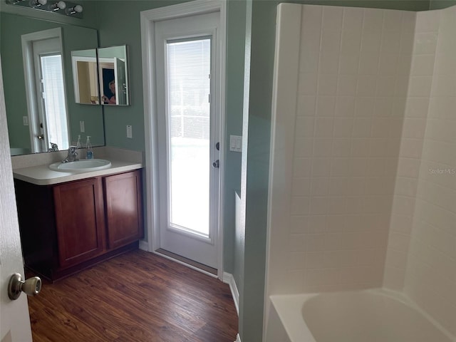 405 Central Mariners Dr, Edgewater, FL 32141 - full bathroom featuring vanity, wood finished floors, and  shower combination