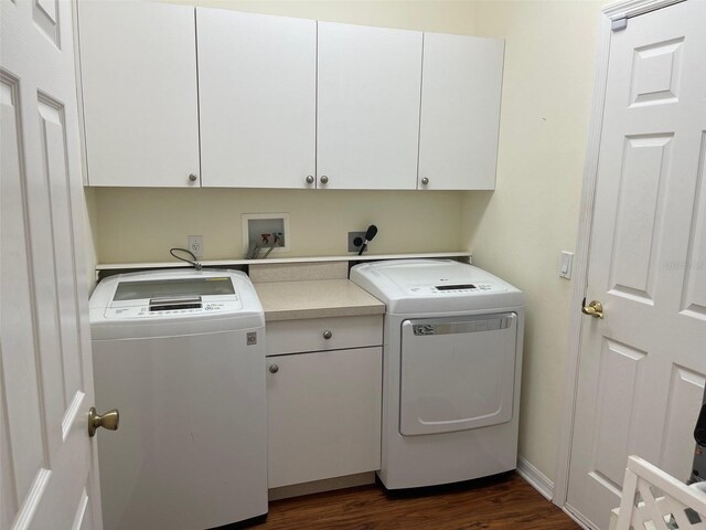 405 Central Mariners Dr, Edgewater, FL 32141 - washroom featuring cabinet space, dark wood-style floors, and washing machine and dryer