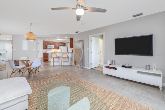 5300 S Atlantic Ave Unit 5-502, New Smyrna Beach, FL 32169 - living area featuring light tile patterned flooring, a ceiling fan, and recessed lighting