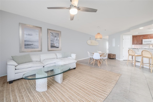 5300 S Atlantic Ave Unit 5-502, New Smyrna Beach, FL 32169 - living room with light tile patterned floors and a ceiling fan