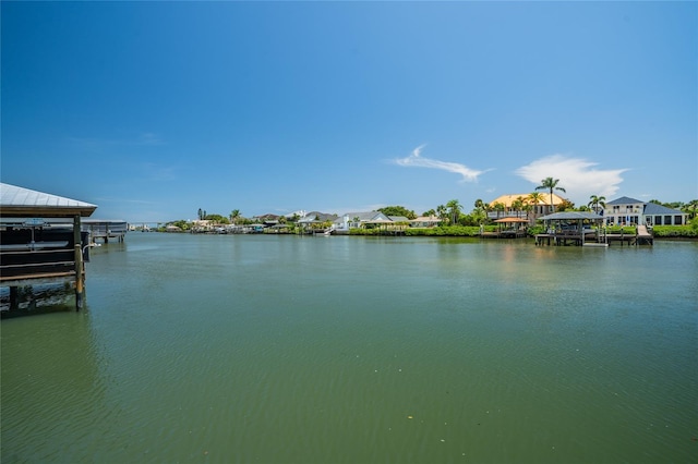 1212 S Riverside Dr, New Smyrna Beach, FL 32168 - water view with boat lift and a dock