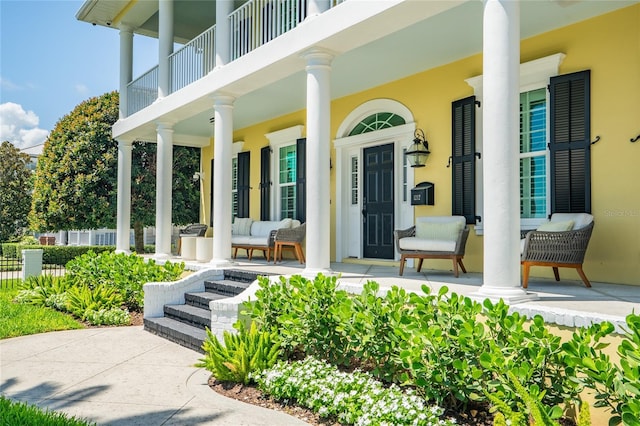 1212 S Riverside Dr, New Smyrna Beach, FL 32168 - entrance to property featuring a porch and stucco siding