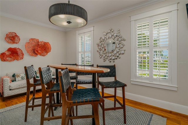 1212 S Riverside Dr, New Smyrna Beach, FL 32168 - dining area with wood finished floors and crown molding