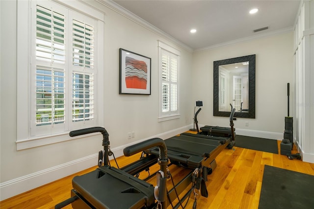 1212 S Riverside Dr, New Smyrna Beach, FL 32168 - exercise room with ornamental molding, wood finished floors, and recessed lighting