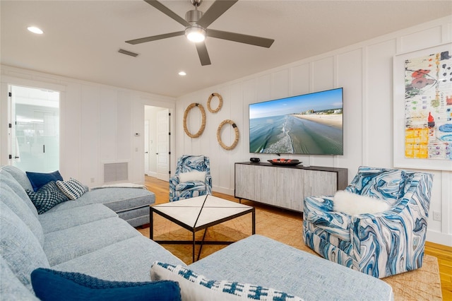 1212 S Riverside Dr, New Smyrna Beach, FL 32168 - living area with a decorative wall, light wood-type flooring, ceiling fan, and recessed lighting