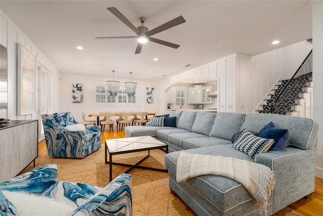 1212 S Riverside Dr, New Smyrna Beach, FL 32168 - living area with wood finished floors, ceiling fan, arched walkways, recessed lighting, and a decorative wall
