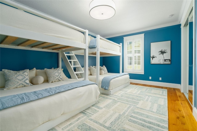 1212 S Riverside Dr, New Smyrna Beach, FL 32168 - bedroom with wood finished floors and crown molding