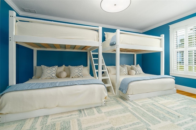 1212 S Riverside Dr, New Smyrna Beach, FL 32168 - bedroom featuring crown molding and wood finished floors