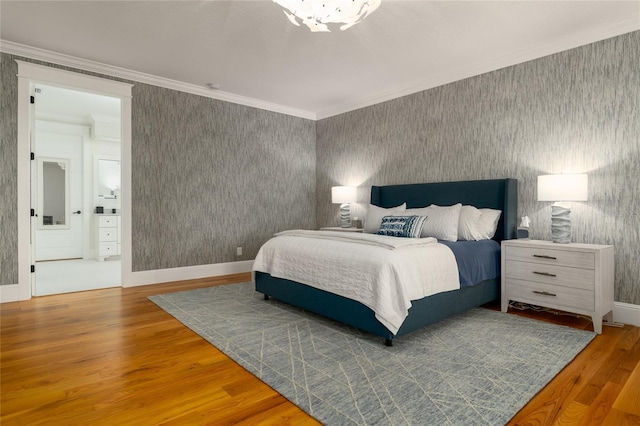 1212 S Riverside Dr, New Smyrna Beach, FL 32168 - bedroom featuring wallpapered walls, wood finished floors, and ornamental molding