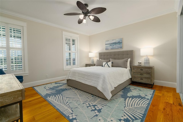 1212 S Riverside Dr, New Smyrna Beach, FL 32168 - bedroom with ornamental molding, wood finished floors, and ceiling fan
