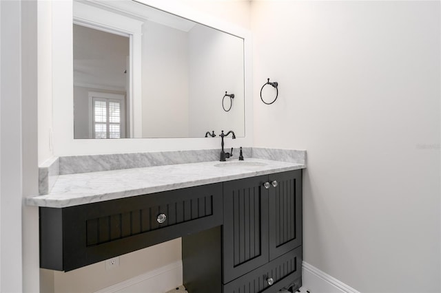 1212 S Riverside Dr, New Smyrna Beach, FL 32168 - bathroom featuring baseboards and vanity
