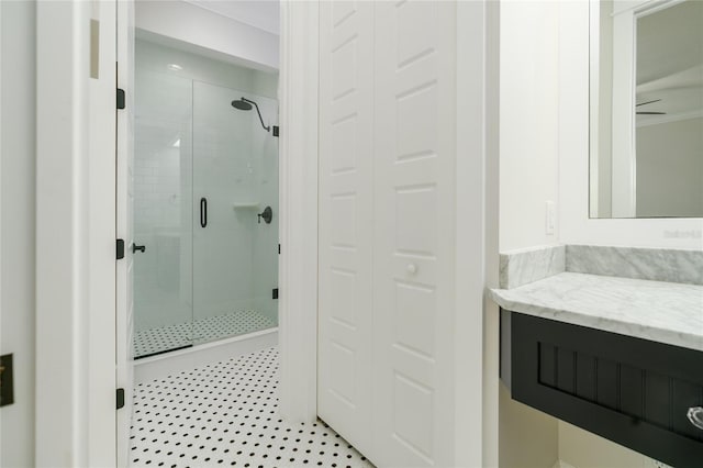 1212 S Riverside Dr, New Smyrna Beach, FL 32168 - full bathroom with a stall shower, vanity, and a ceiling fan