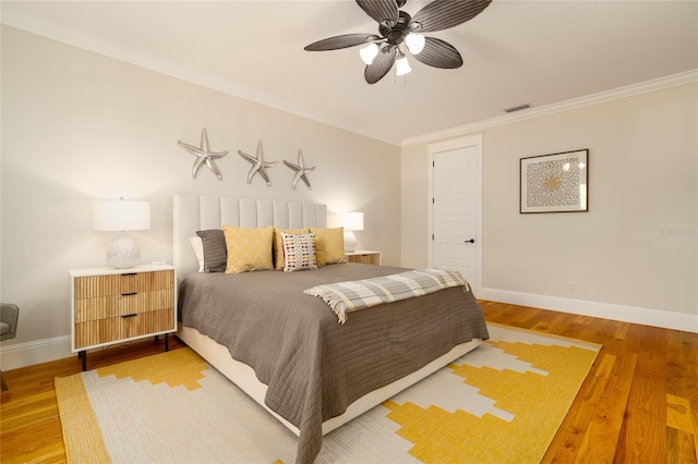 1212 S Riverside Dr, New Smyrna Beach, FL 32168 - bedroom featuring light wood finished floors, ornamental molding, and a ceiling fan