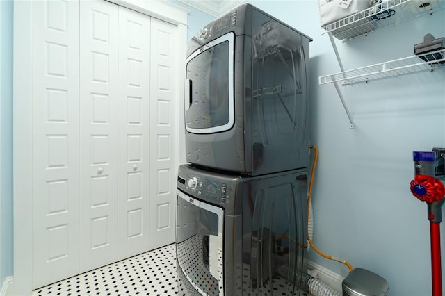 1212 S Riverside Dr, New Smyrna Beach, FL 32168 - laundry area with estacked washer and dryer and crown molding