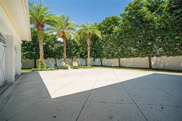 1212 S Riverside Dr, New Smyrna Beach, FL 32168 - fenced backyard featuring a patio
